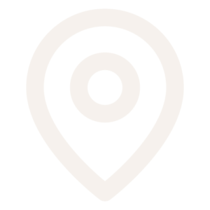 A simple, light gray location pin icon on a white background.